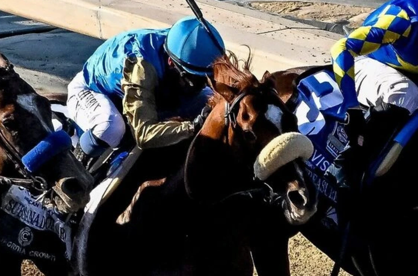 Subsanador (center)(2), ridden by Mike Smith,wins the California Crown Stakes