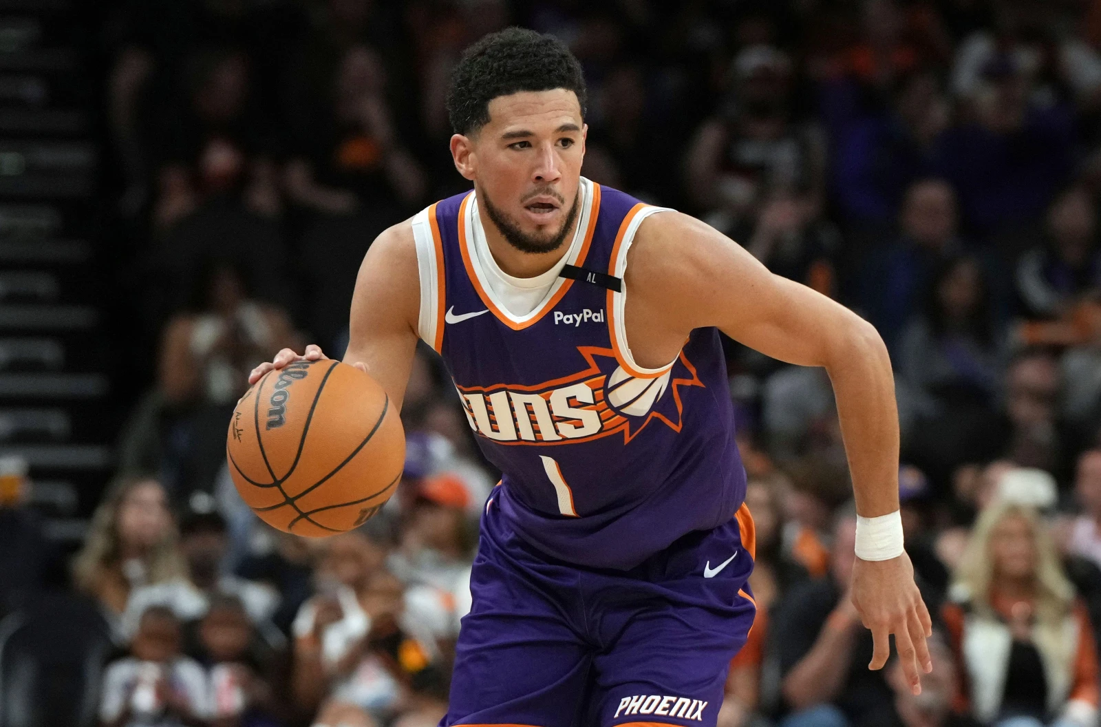 Phoenix Suns guard Devin Booker dribbles the basketball