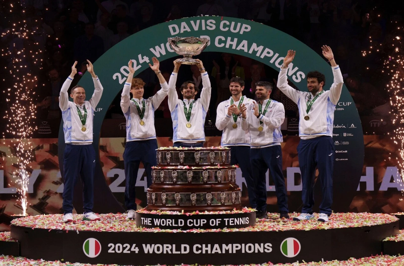 Team Italy celebrate the victory with the trophy after winning during the Davis Cup 2024