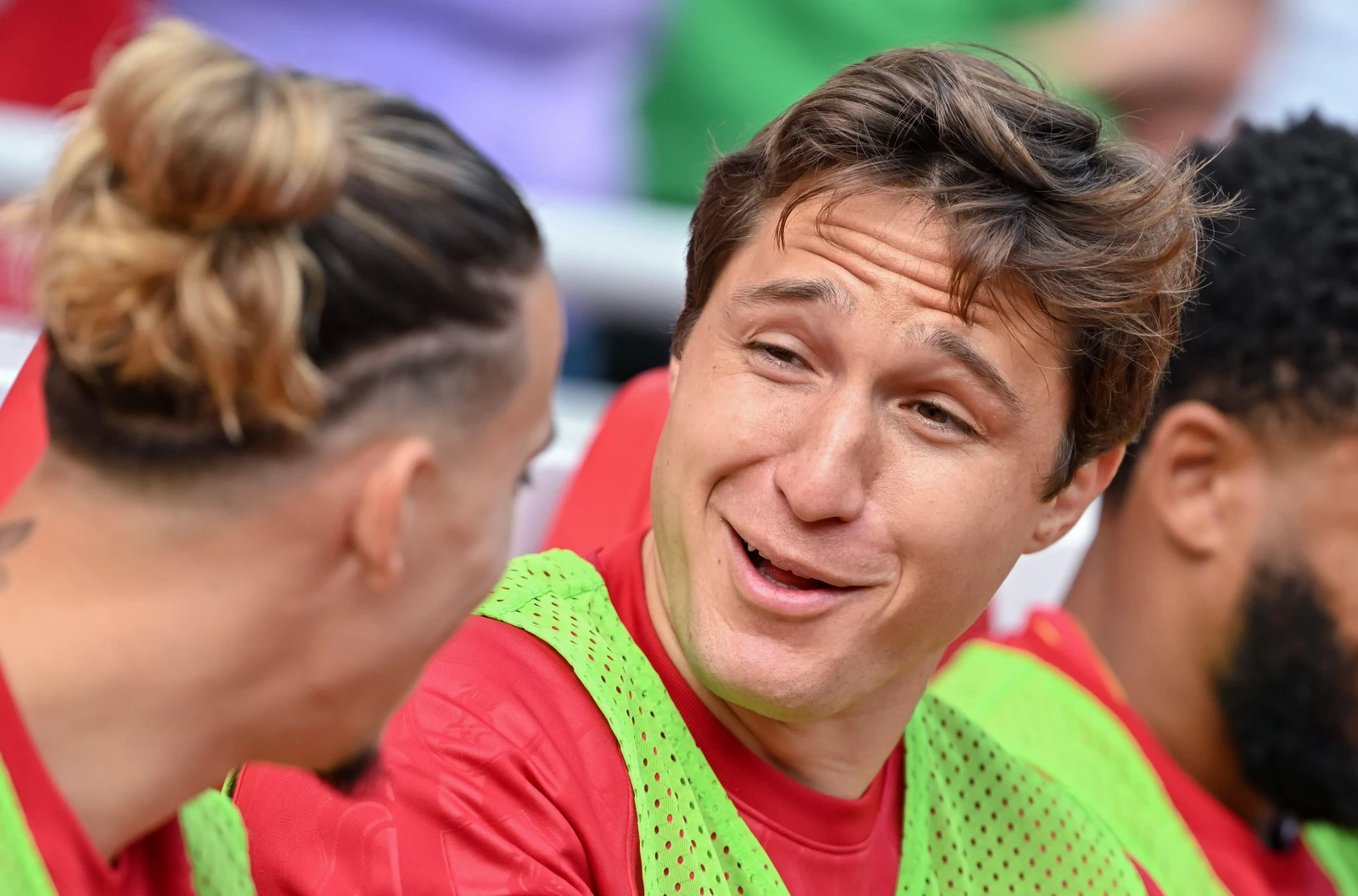 Federico Chiesa of Liverpool shares a joke with Kostas Tsimikas of Liverpool