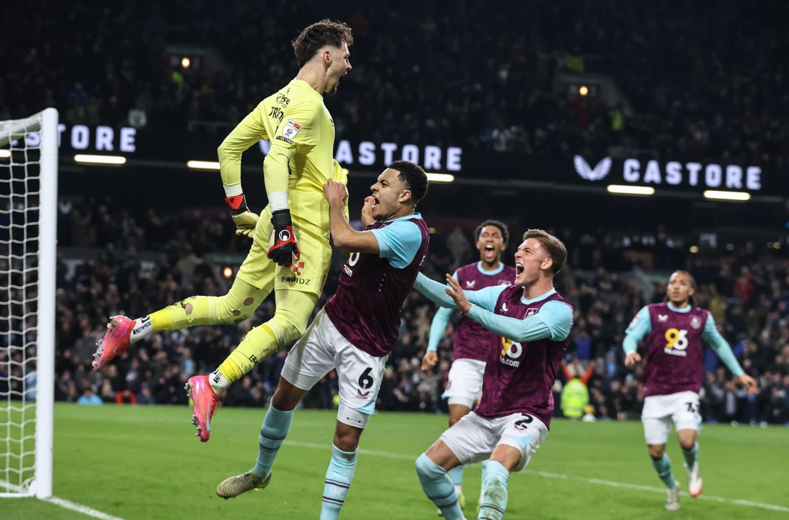 Burnley goalkeeper James Trafford celebrates saving a penalty