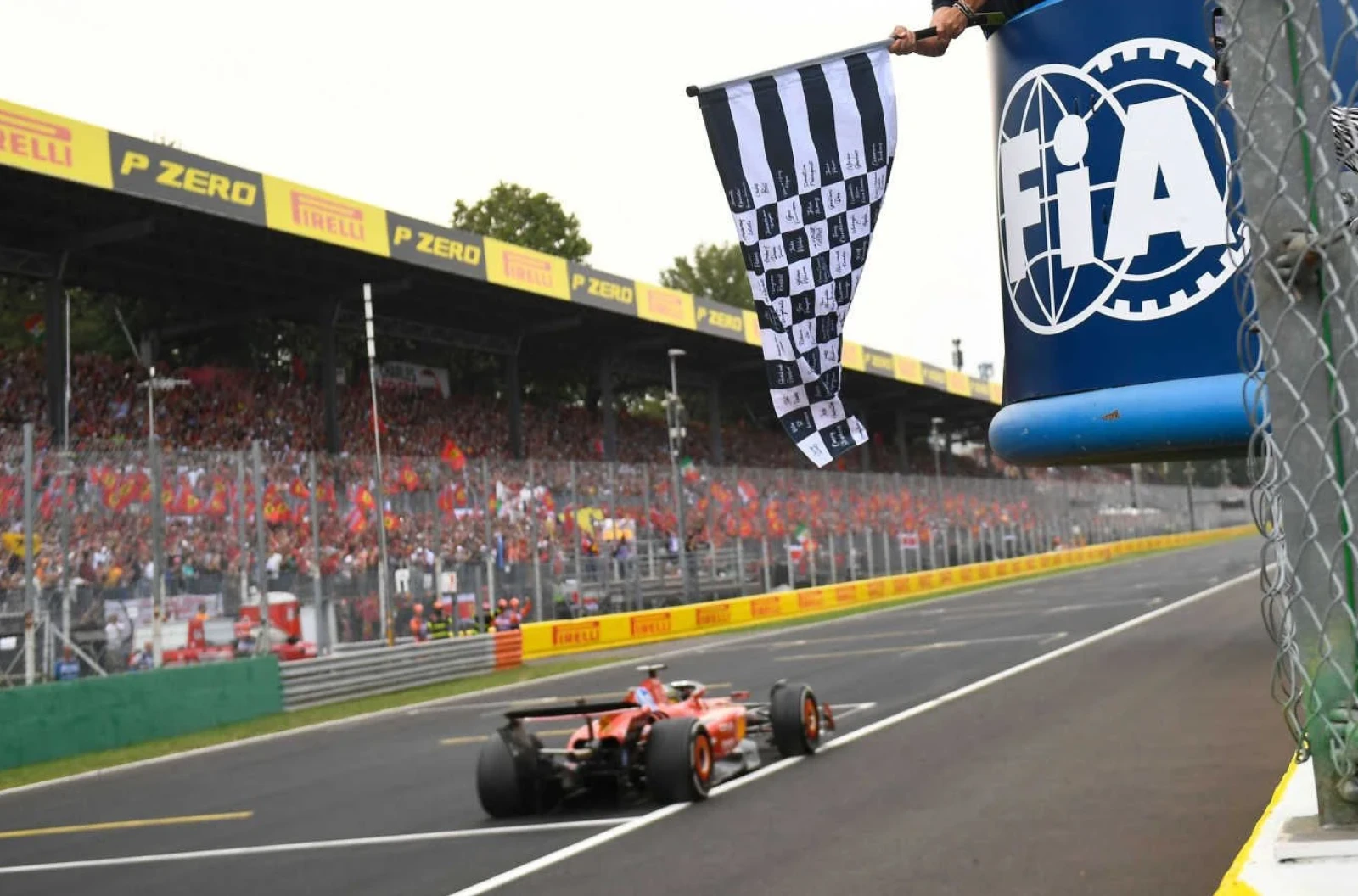 Ferrari driver Charles Leclerc of Monaco crosses the finish line to win the Formula One Italian Grand Prix race at the Monza racetrack