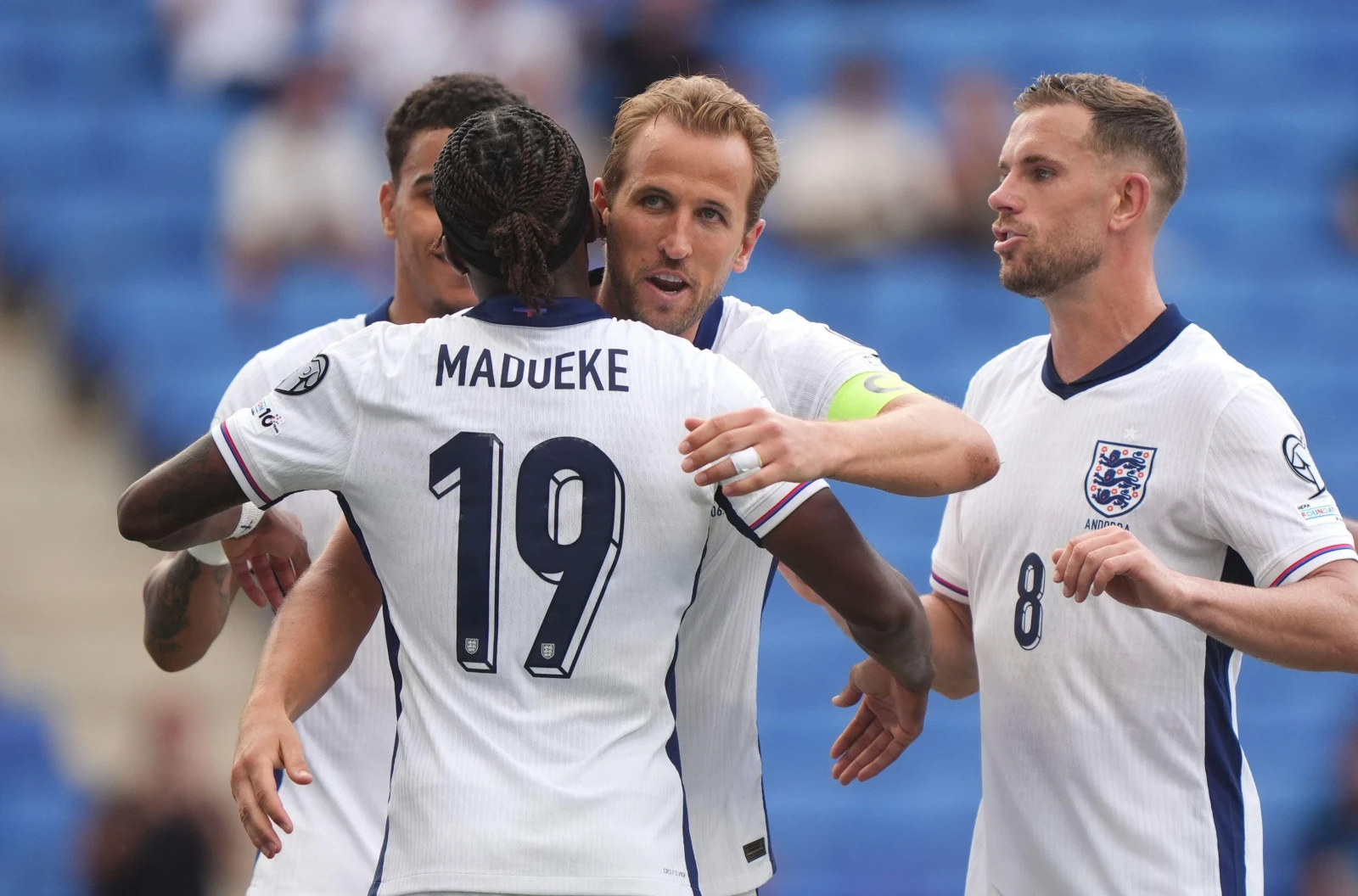 England's Harry Kane celebrates with team-mate Noni Madueke