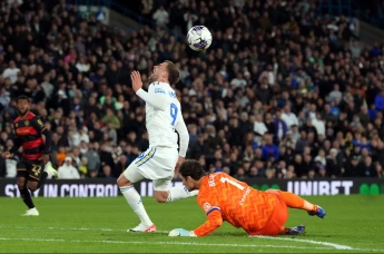 Queens Park Rangers goalkeeper Asmir Begovic fouls Leeds United's Patrick Bamford