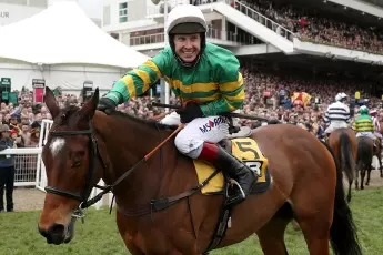 Richard Johnson celebrates winning the 2017 Triumph Hurdle on Defi Du Seuil