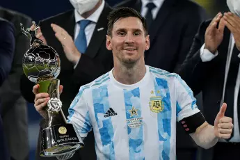 Lionel Messi player from Argentina lifts the champion's cup during an award ceremony at the end of the match against Brazil at the Maracana stadium for the decision of the Copa America 2021