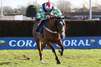 Our Power ridden by Sam Twiston-Davies clears a fence before winning the Coral Trophy Handicap Chase at Kempton Park