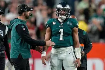Philadelphia Eagles head coach Nick Sirianni, left, talks with quarterback Jalen Hurts