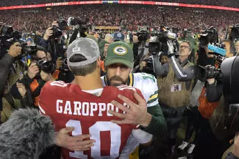 San Francisco 49ers quarterback Jimmy Garoppolo hugs Green Bay Packers quarterback Aaron Rodgers