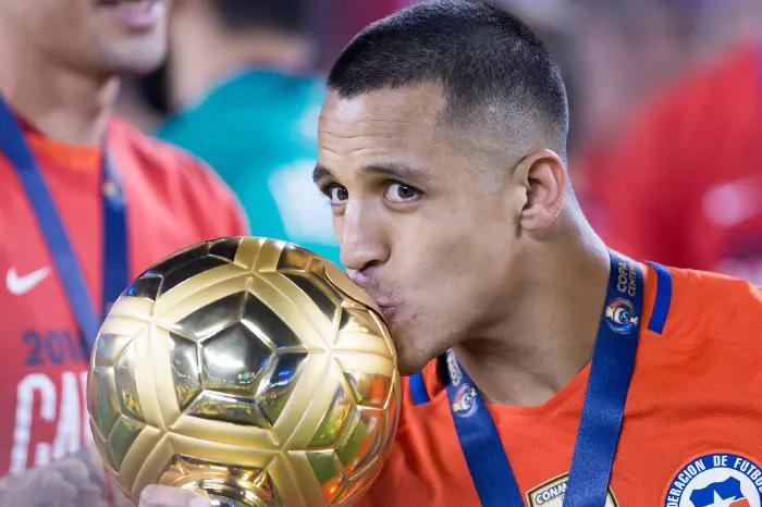 Alexis Sanchez kisses the Golden Ball for Copa America's best player of the tournament