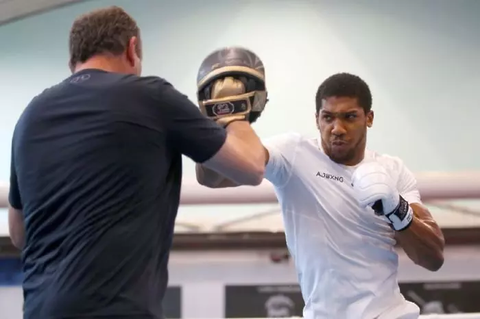 Anthony Joshua and coach Robert McCracken during a media workout