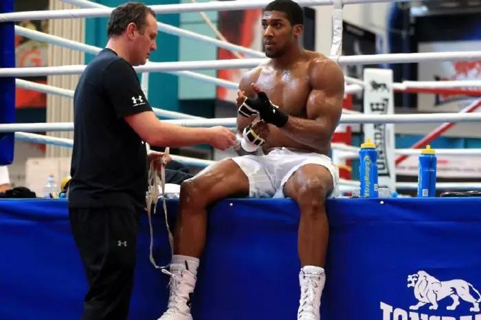 Anthony Joshua and coach Robert McCracken during a media workout