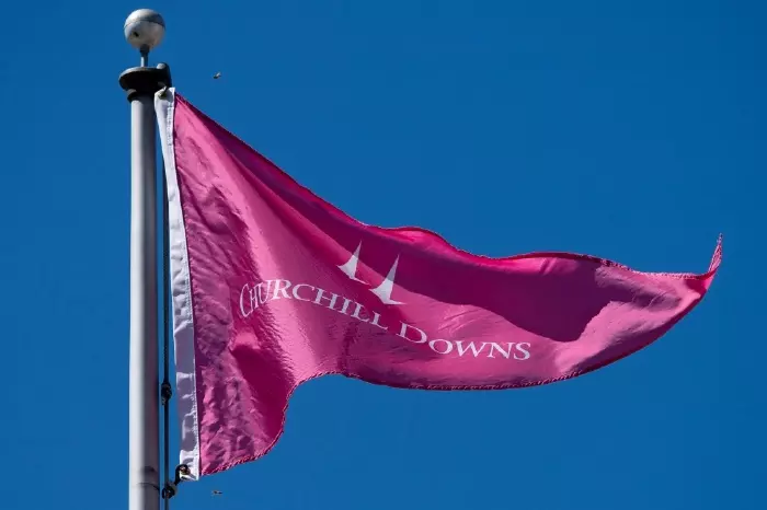 A Churchill Downs flag flutters over the racecourse