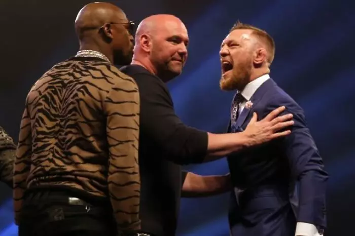 Conor McGregor (right) and Floyd Mayweather with UFC President Dana White