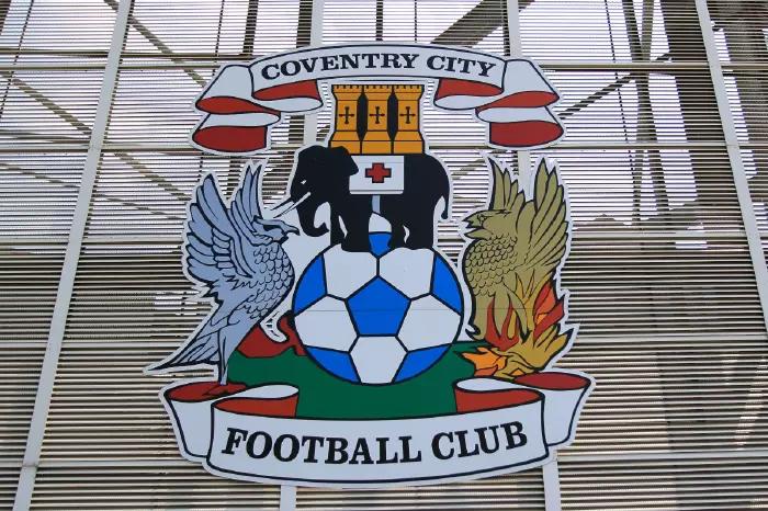 Coventry City badge on the outside of the stadium