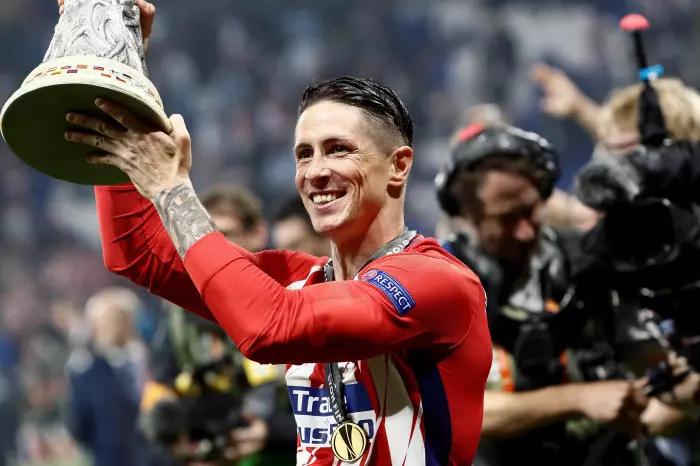 Fernando Torres of Atletico Madrid celebrates with the Europa League trophy in 2018