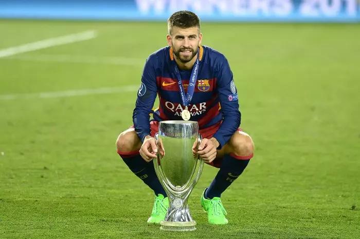 Gerard Pique of FC Barcelona holding the UEFA Super Cup, 2015