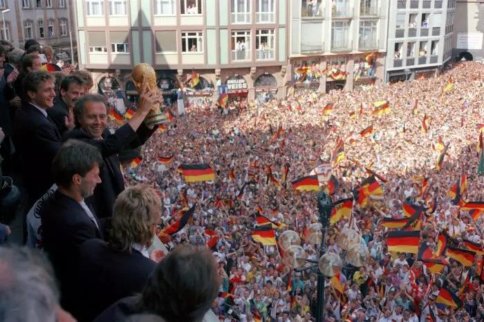 Germany and their fans celebrate with the World Cup trophy in 1990