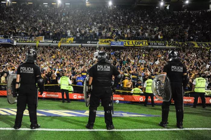 Boca Juniors match against Gimnasia abandoned after fatal clashes between fans and the police