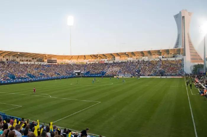Fans cheer on their Montreal Impact team at the newly renovated Saputo Stadium