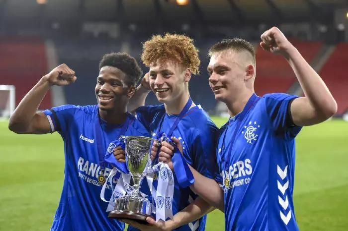 Rangers goal scorers Adedapo Mebude, Nathan Young-Coombes and Ciaran Dickson celebrate with the trophy after the Scottish FA Youth Cup final at Hampden Park, Glasgow.