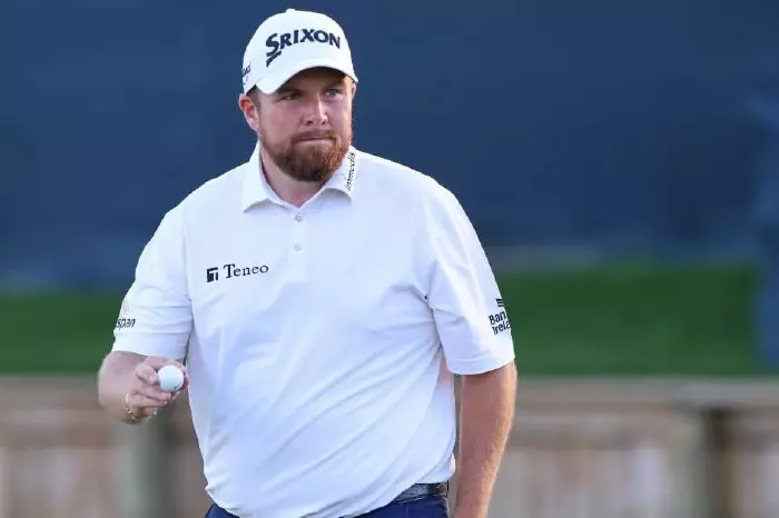 Shane Lowry holes a putt