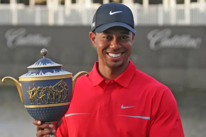 Tiger Woods poses with the trophy after winning the WGC-Cadillac Championship