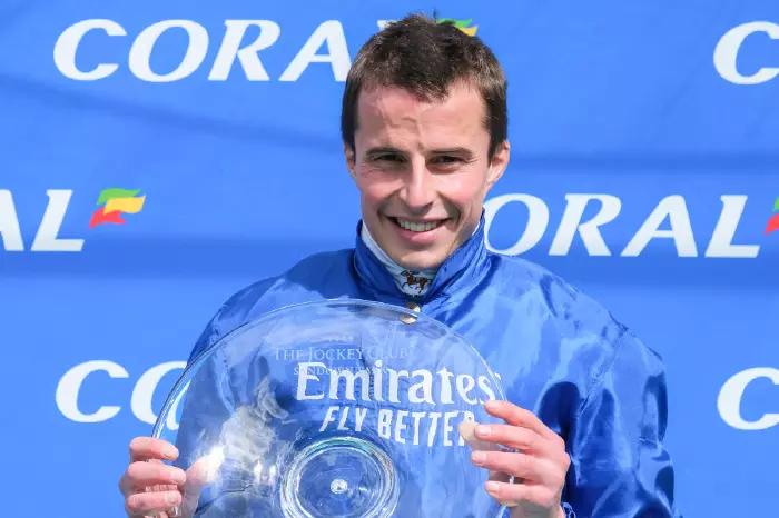 Jockey William Buick with the trophy after winning the Coral Eclipse at Sandown Park Racecourse in Surrey on July 5, 2020
