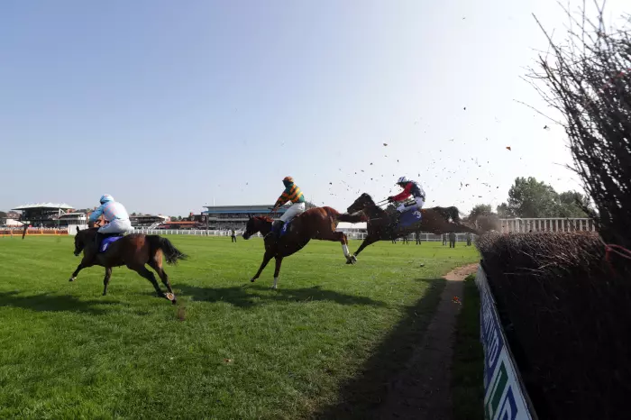 Kitty's Light and Jack Tudor (right) make ground en route to victory at Warwick