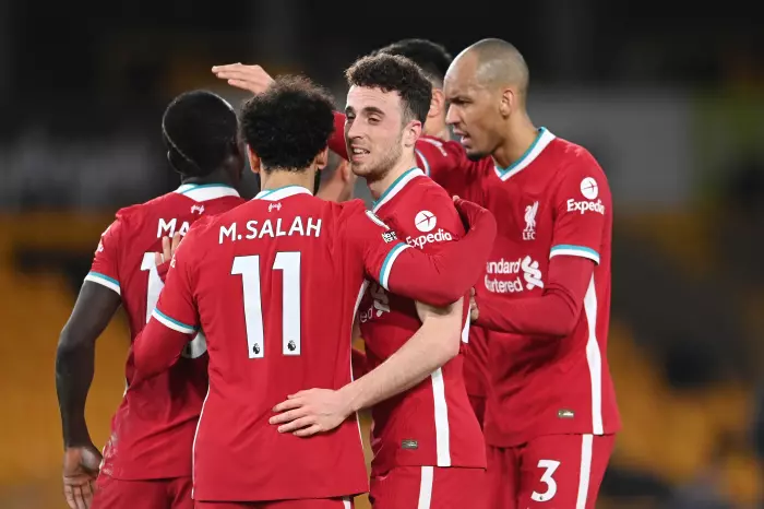 Liverpool's Diogo Jota celebrates with Mohamed Salah and Fabinho after scoring against Wolves