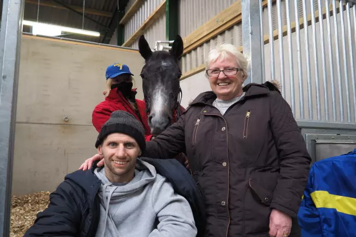 Rob Burrow and his mother Irene stand in front of Burrow Seven at Jedd O'Keeffe's racing yard in Middleham, Yorkshire