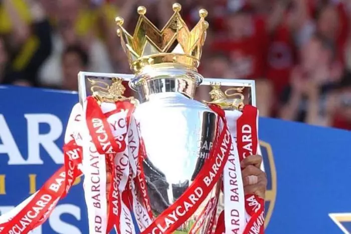 Thierry Henry lifts the Premier League trophy after Arsenal went unbeaten through the 2003-04 season