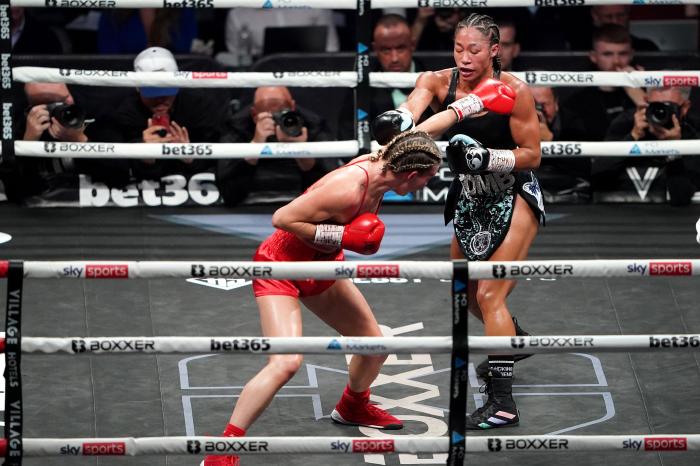 Alycia Baumgardner and Mikaela Mayer exchange punches during their unified super featherweight championship fight at The O2, London - October 2022