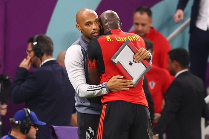 Belgium assistant coach Thierry Henry consoles Romelu Lukaku at World Cup