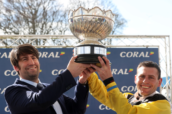 Christian Williams and Rob James pose with the Scottish Grand National