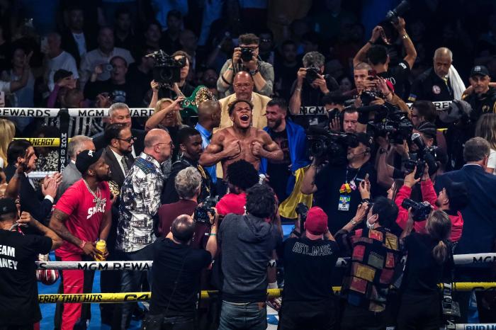 Devin Haney celebrates after defending his undisputed championship winning by unanimous decision - May 2023