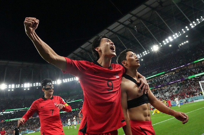 Hwang Hee-chan celebrates scoring for South Korea