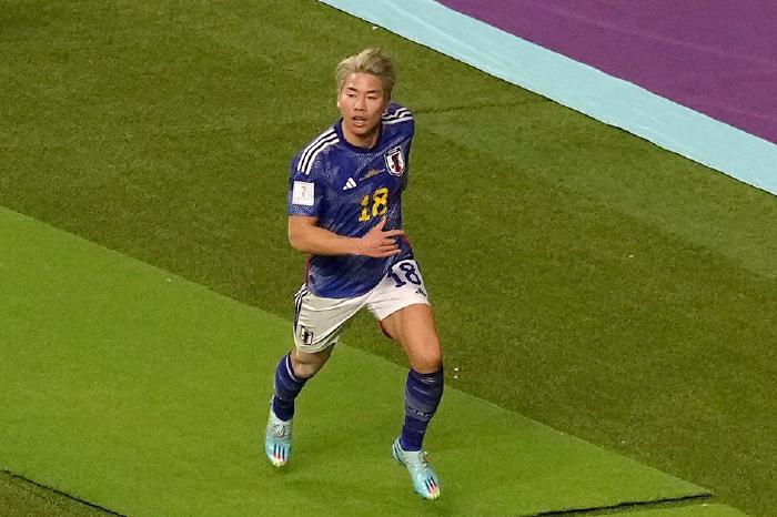 Japan's Takuma Asano celebrates at the FIFA World Cup