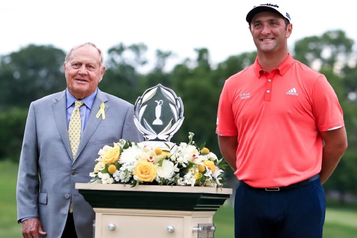 Jon Rahm set to receive the trophy from Jack Nicklaus