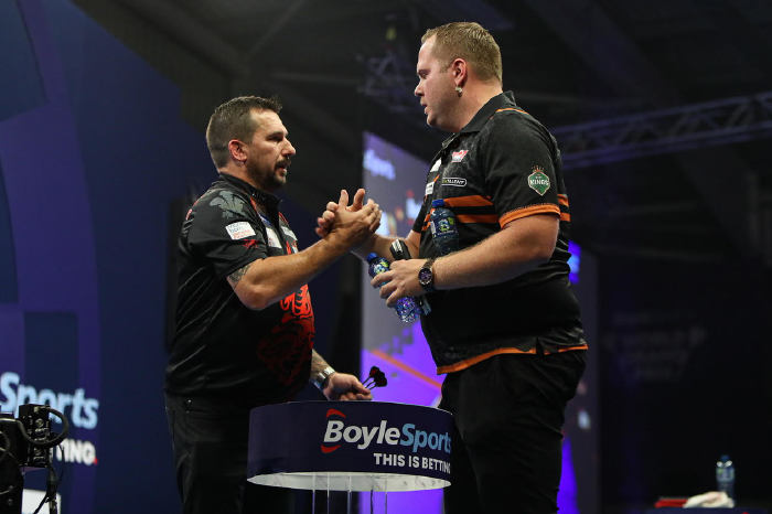 Jonny Clayton and Dirk van Duijvenbode shake hands at the BoyleSport World Grand Prix