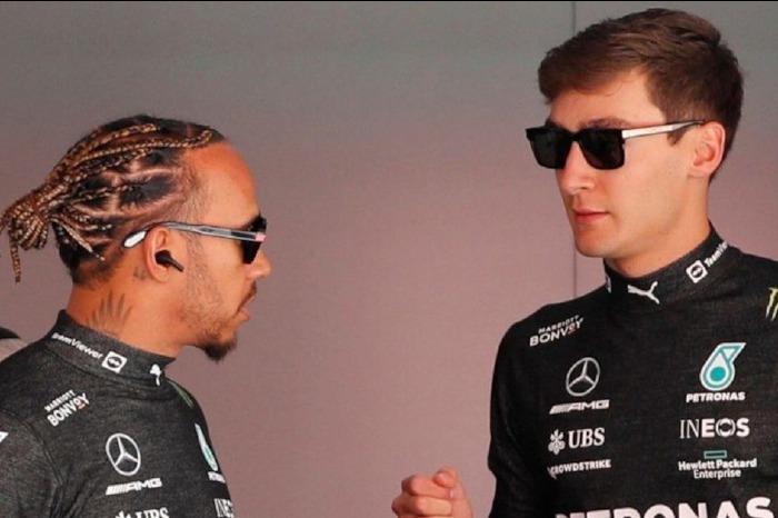 Lewis Hamilton and George Russell fist bump