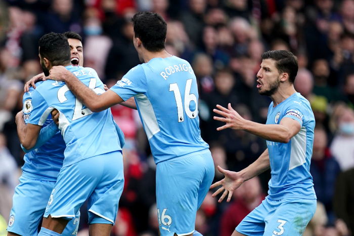 Manchester City celebrate Rodri's winner against Arsenal