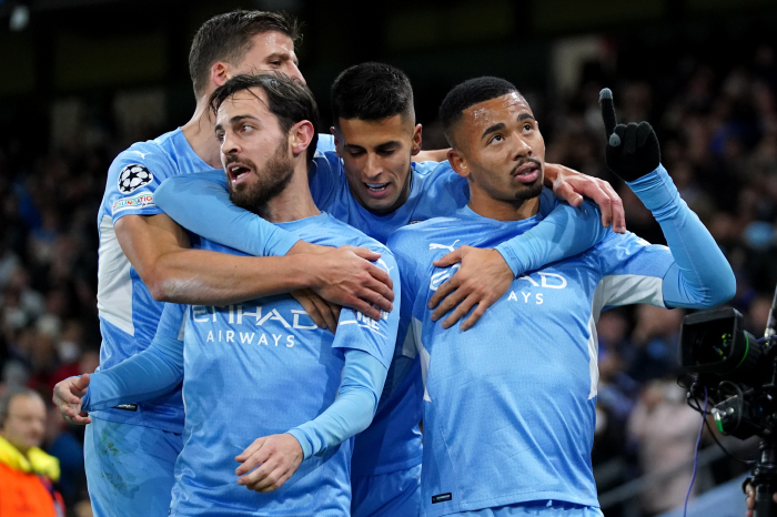 Manchester City celebrate their win over PSG at the Etihad Stadium