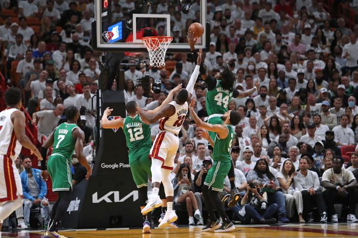 Miami Heat center Bam Adebayo loses ball to Boston Celtics center Robert Williams during game seven of Eastern Conference finals