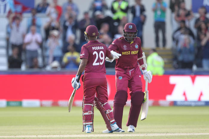 Nicholas Pooran of West Indies celebrates with Sheldon Cottrell after scoring a hundred