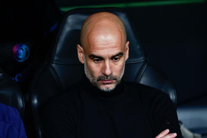 Pep Guardiola dejected during Real Madrid defeat