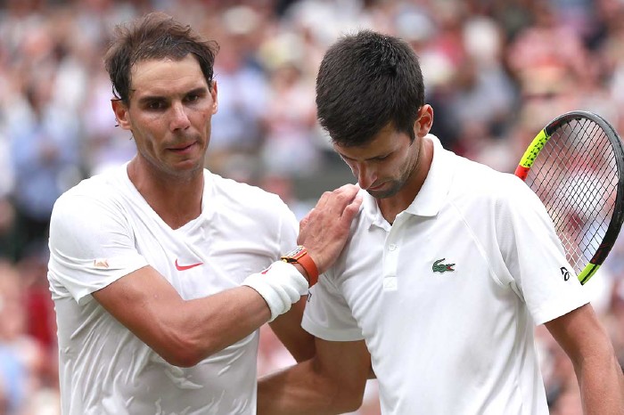 Rafael nadal comforts Novak Djokovic