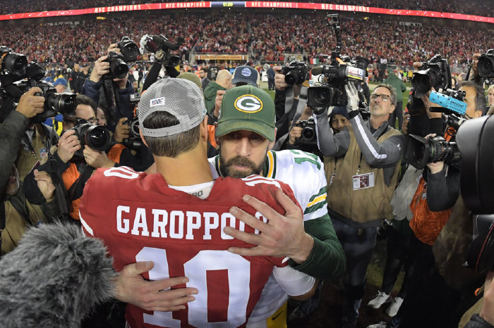 San Francisco 49ers quarterback Jimmy Garoppolo hugs Green Bay Packers quarterback Aaron Rodgers