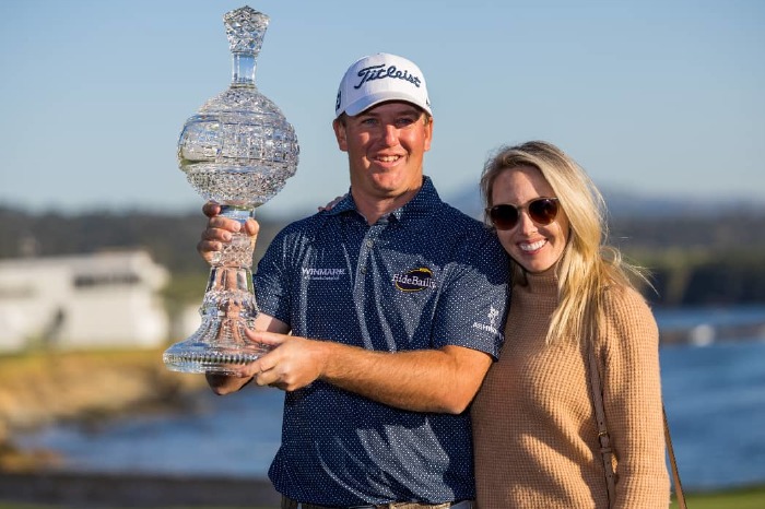 Tom Hoge with the trophy at Pebble Beach