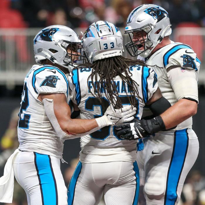 Carolina Panthers running back D'Onta Foreman is congratulated by teammates after scoring a touhdown